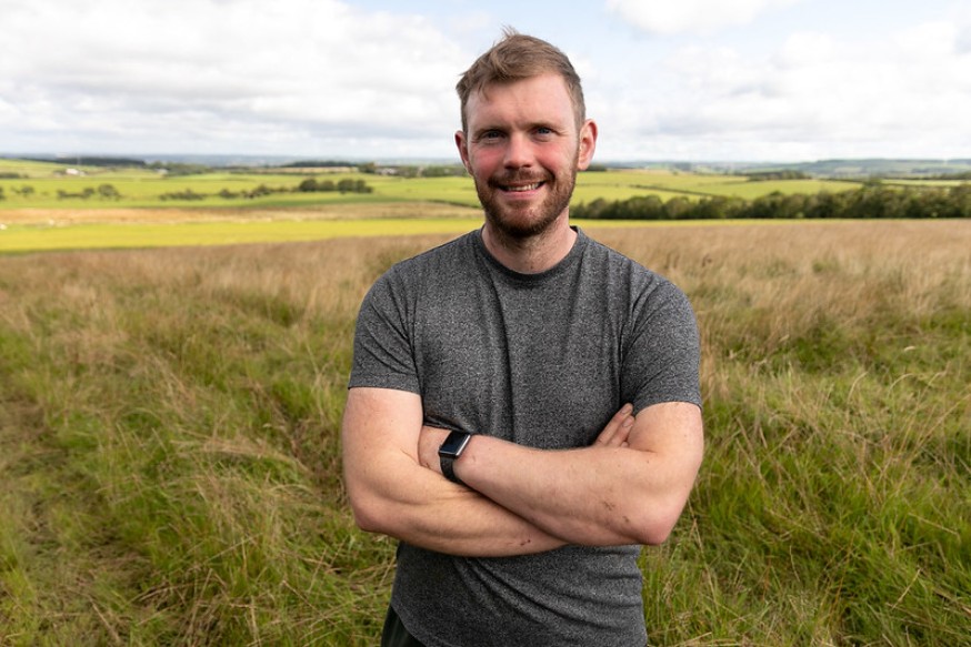 Photo of Bryce Cunningham smiling. Bryce is a young farming climate champion.