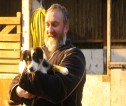 A man holding a small dog