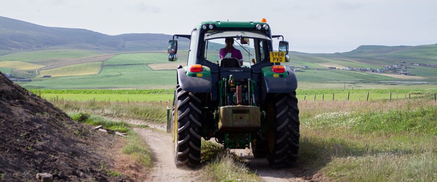 Image showing a women in agriculture driving a tractor Image showing a women in agriculture driving a tractor
