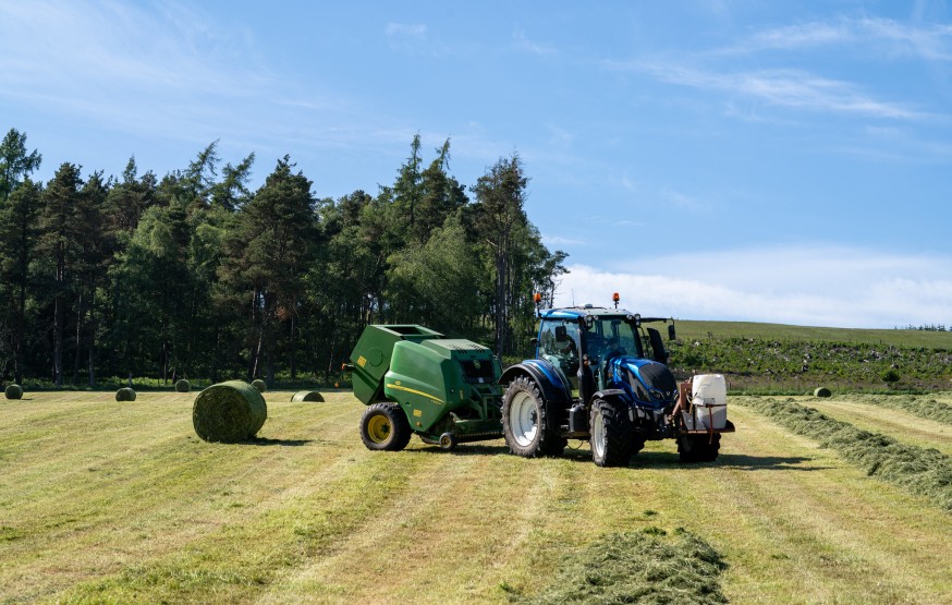 Tractor baling silage