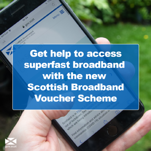 Picture of phone with information on broadband scheme Picture of phone with information on broadband scheme