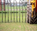 Close up of slurry spreader teeth, with tractor tyre in foreground