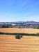 Combine harvester side view from drone
