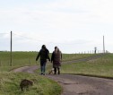 Two dog walkers on a countryside path
